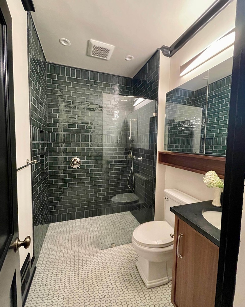 bathroom with green subway tile