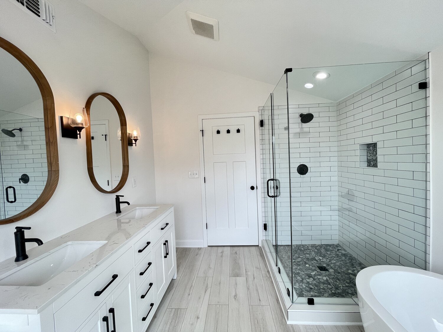 white-bathroom-remodel-with-his-and-her-sinks